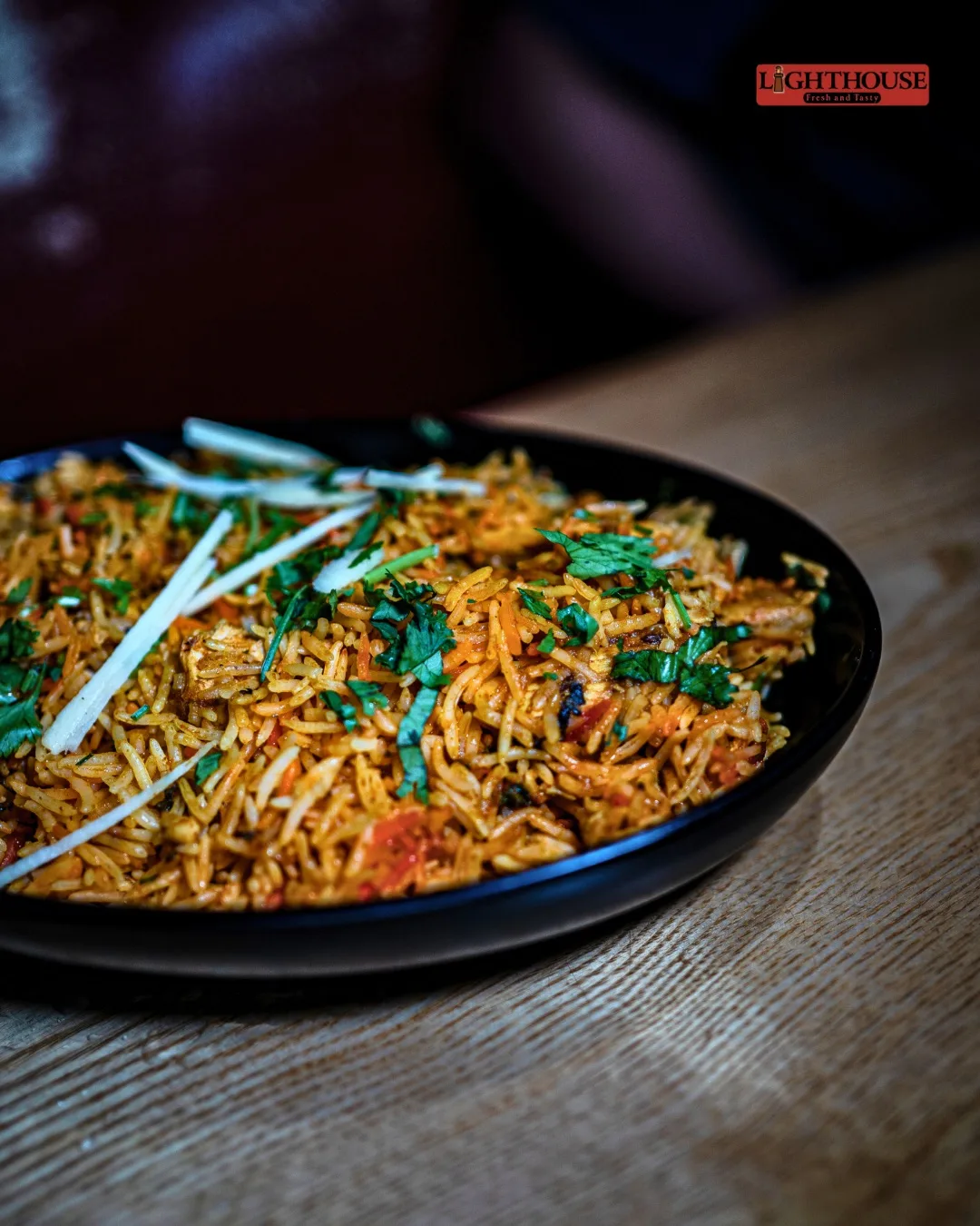 Fragrant biryani finished with fresh herbs